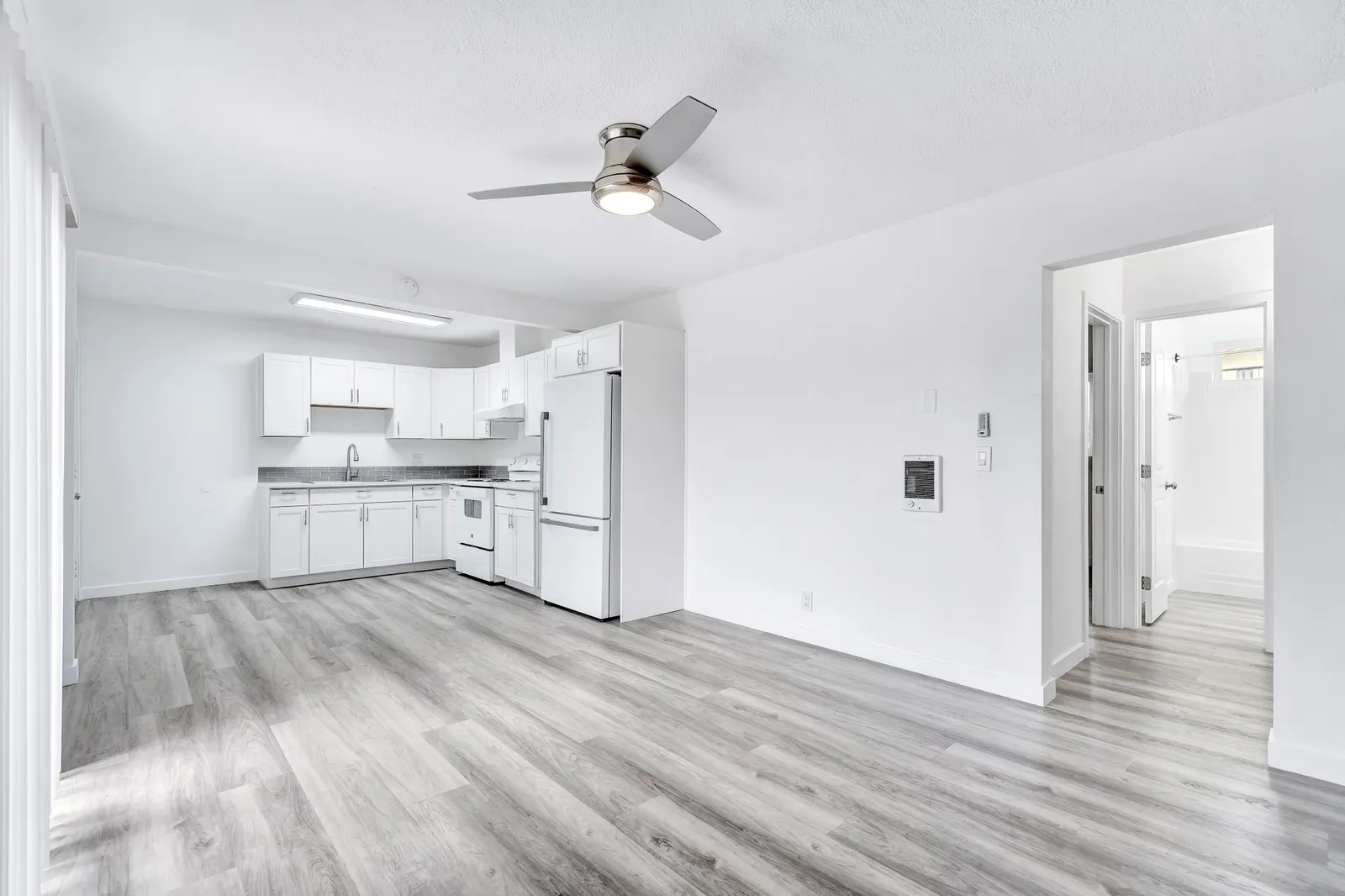 Bright open living area and kitchen in a renovated Palm View Village apartment